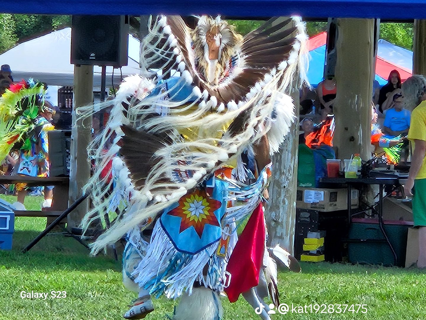 3c657d4e7ac649a6fa4162d2da128457_10 A group of Indigenous people celebrating in their traditional garments.