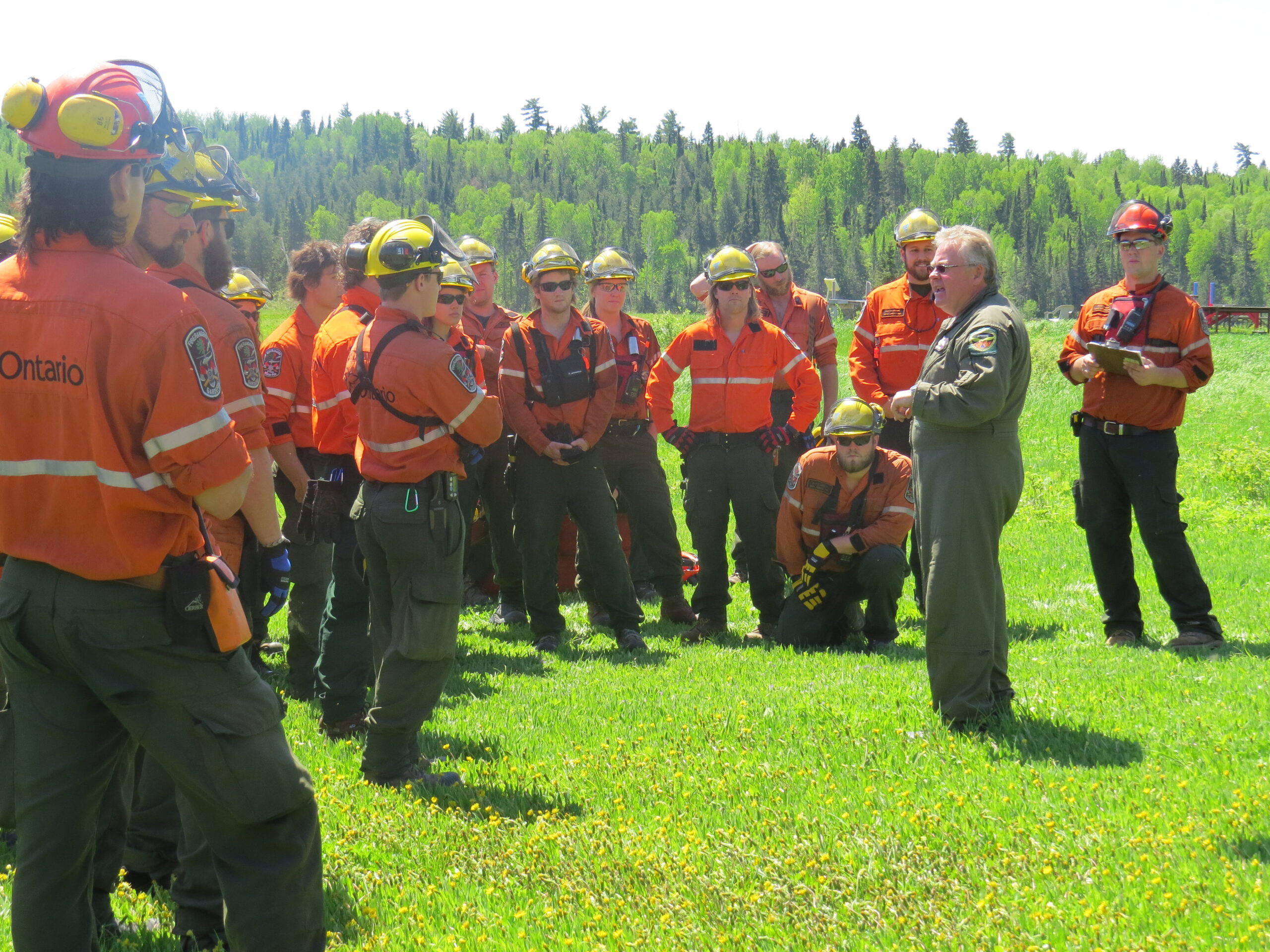 IMG_2304 A man speaks to the crowd at a firefighting training course.